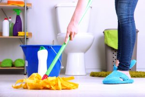 How do you clean and disinfect a bathroom floor?